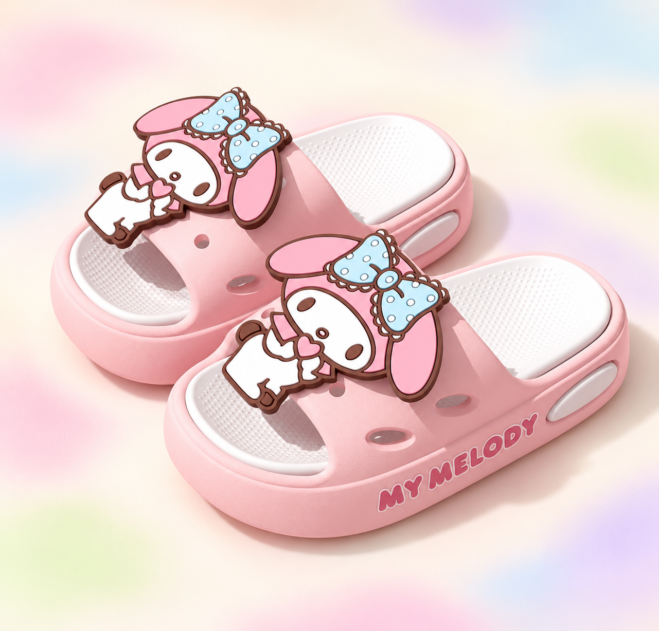 Pink character charm slides on a branded studio backdrop