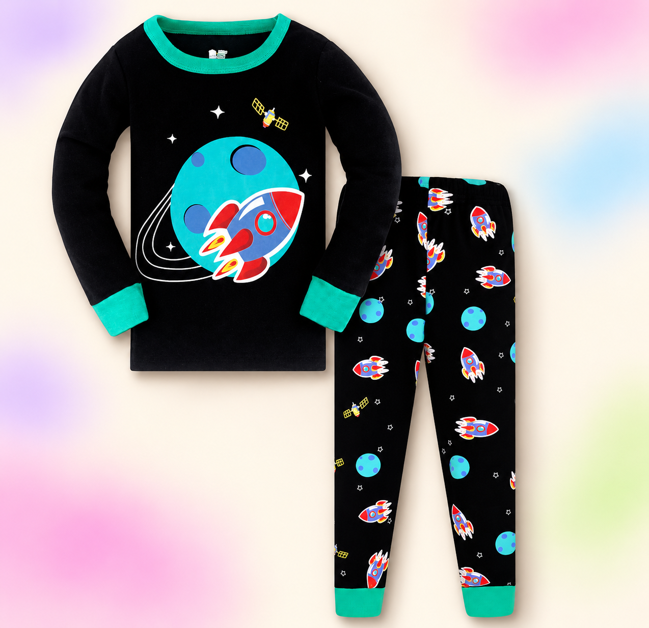 Black and teal pajama set on a soft pastel branded studio background.
